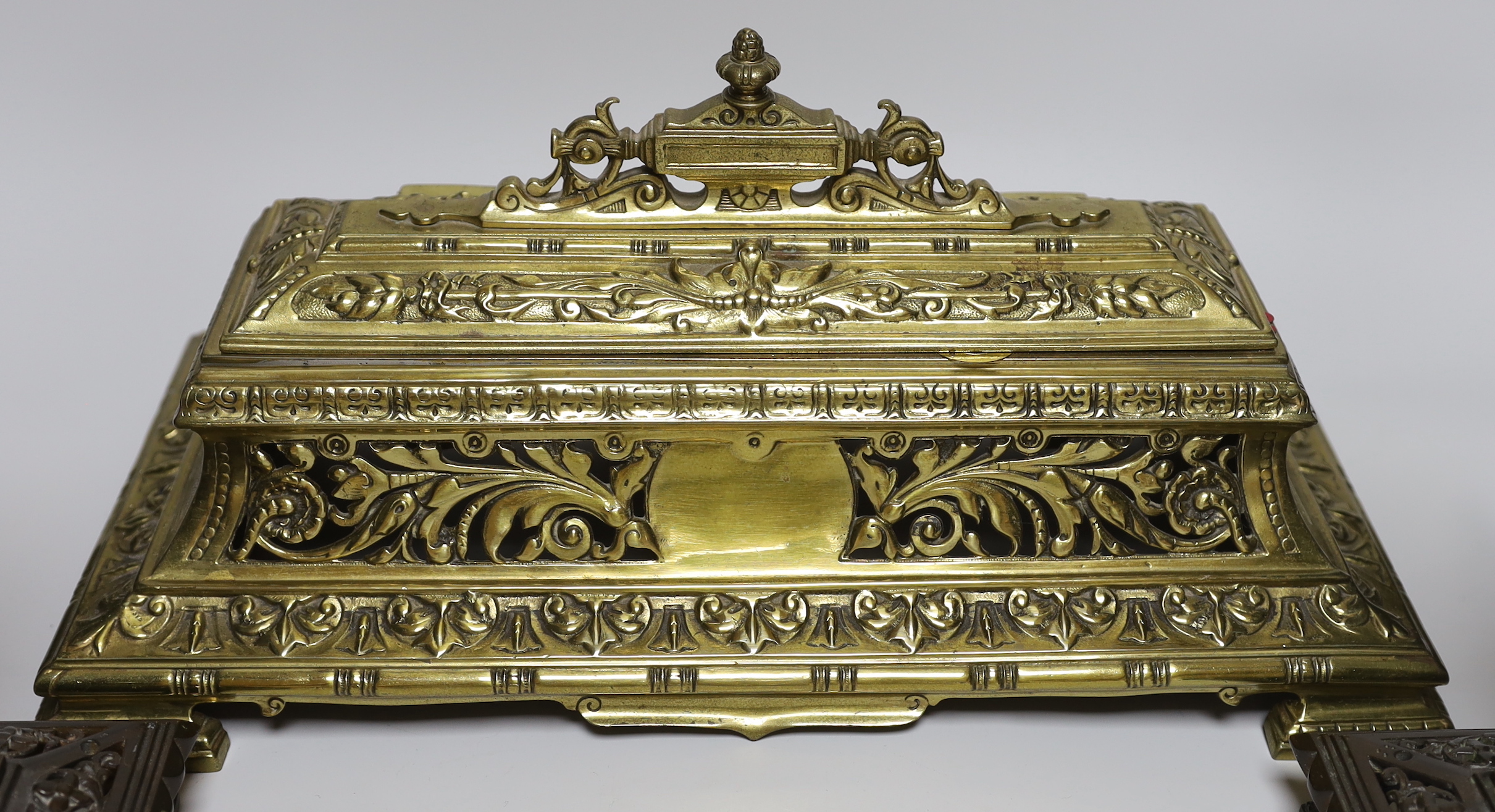 A Victorian cast brass pen and inkstand and a pair of cast brass candlesticks (3) 24.5cm tall